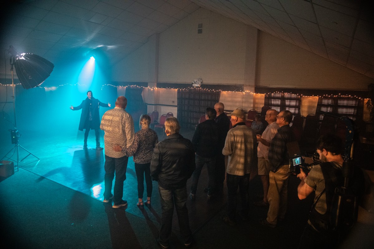 Music video production with dramatic blue stage lighting