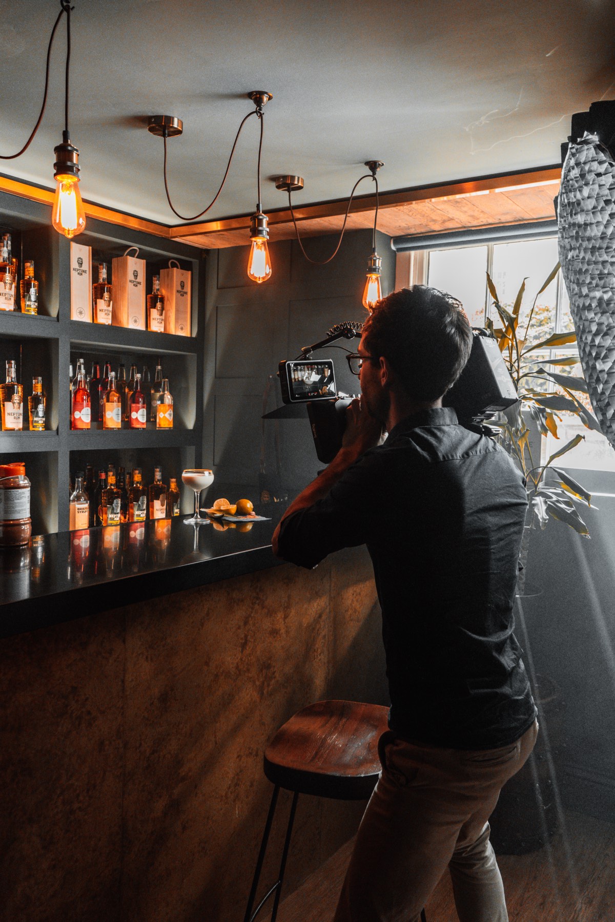 Filming product close-up for Neptune Rum behind the bar